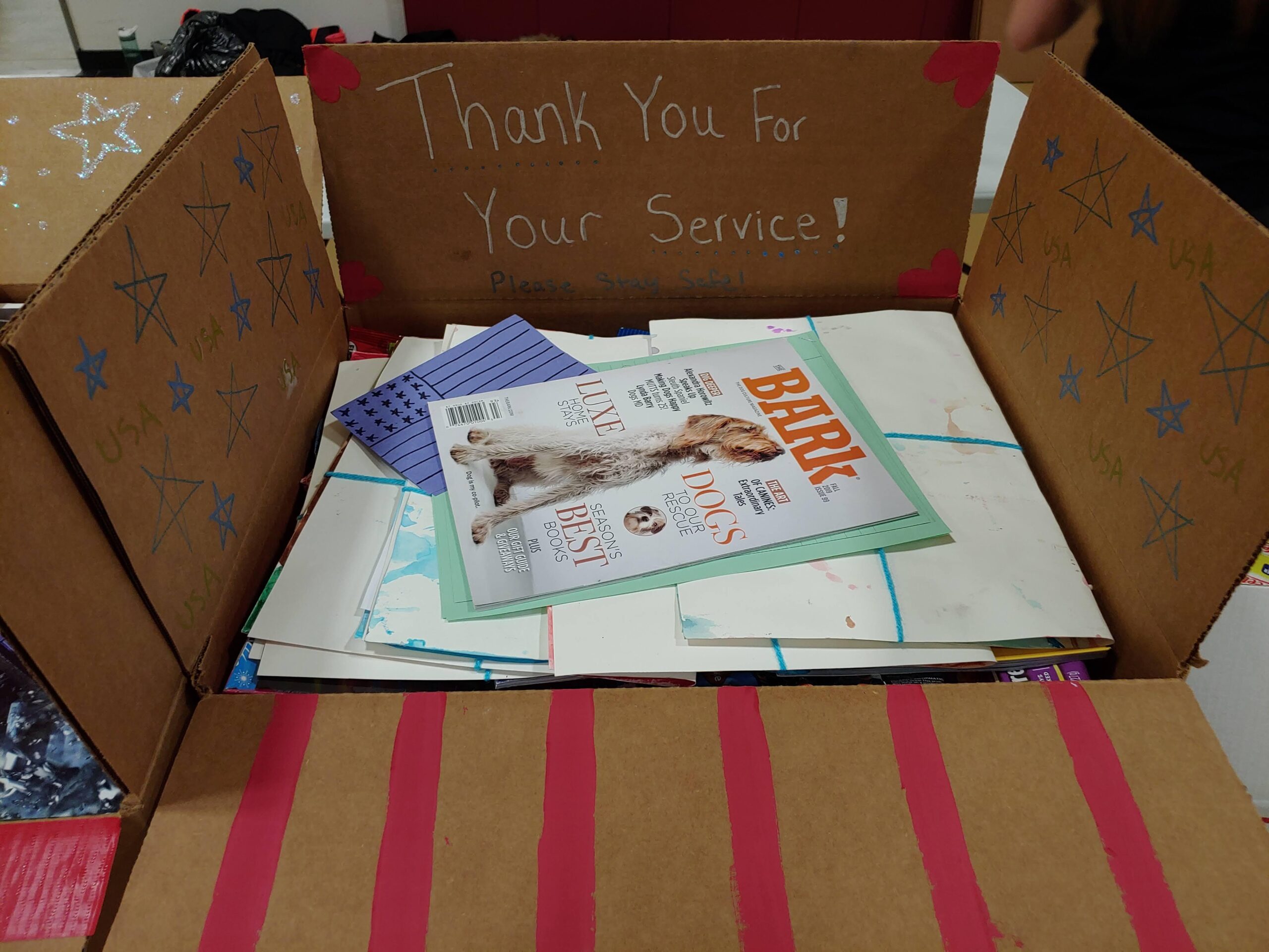 Military Care Package Including Gum, Candy, and Other Snacks.